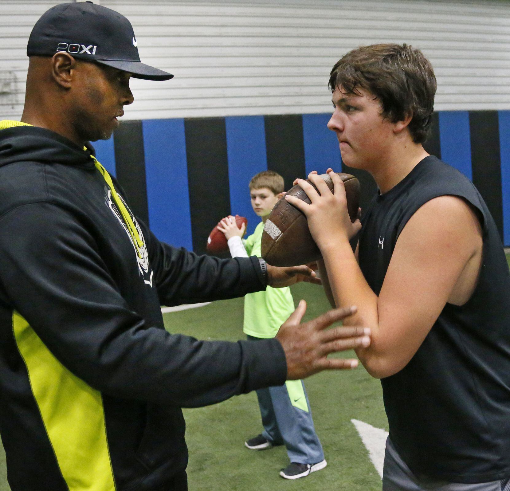 Former Texas A&M quarterback Kevin Murray works as a quarterbacks coach with 16-year-old...