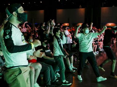 Fans react after Chicago OpTic win a game against Dallas Empire during the Call of Duty League Major V tournament at Esports Stadium Arlington on Sunday, Aug. 1, 2021, in Arlington. Empire finished 4th in the tournament after a 3-1 loss to OpTic.