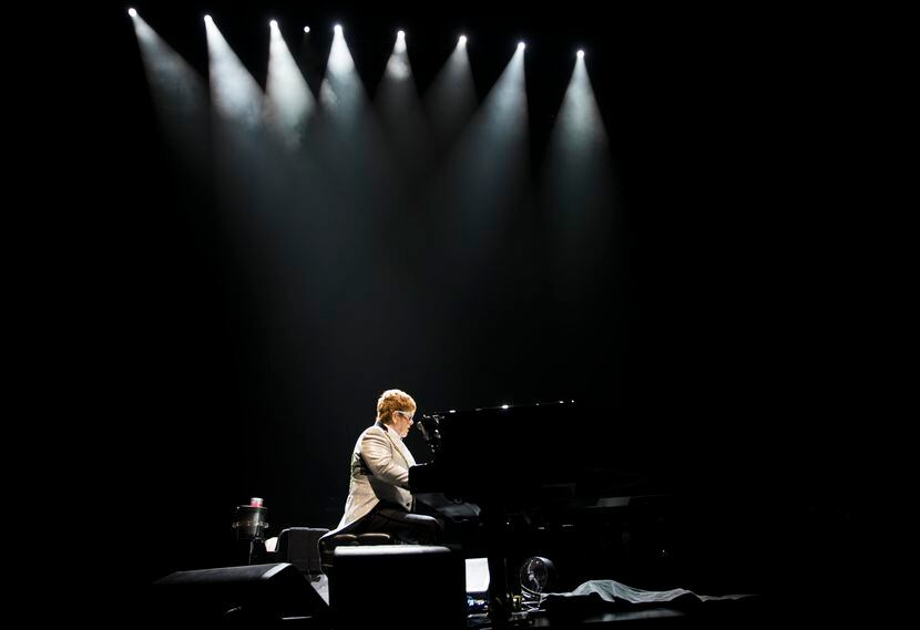 Elton John performs "Bennie and the Jets" at American Airlines Center in Dallas on Friday,...