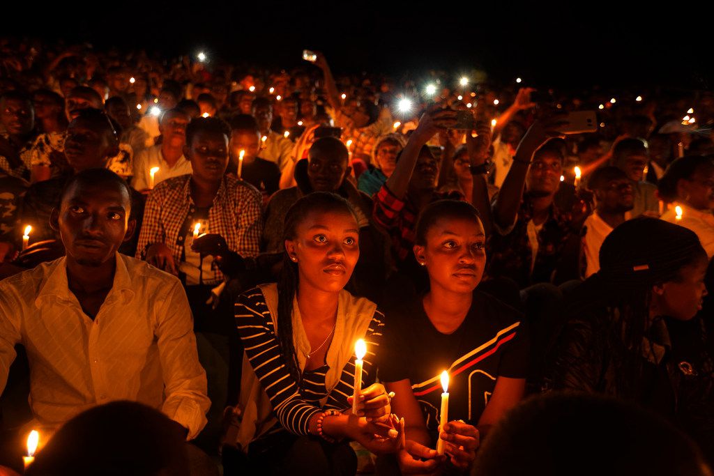 People attend a vigil during the memorial service held at Amahoro stadium in the capital...