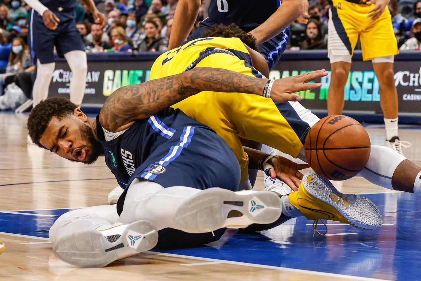 Dallas Mavericks forward Marquese Chriss (32) fights for the ball with Indiana Pacers guard Terry Taylor (32) during the second half at the American Airlines Center in Dallas on Saturday, January 29, 2022.