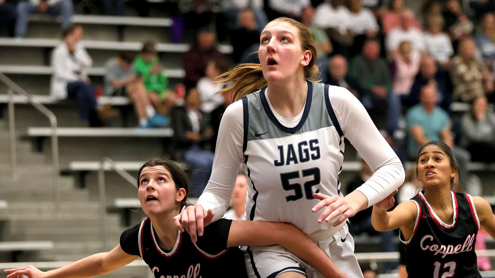 Flower Mound center Abbie Boutilier (52) looks to rebound against Coppell during the first...