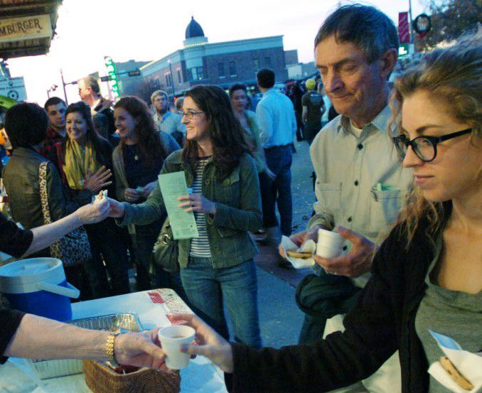 People line up for samples during Wassail Weekend in Denton.