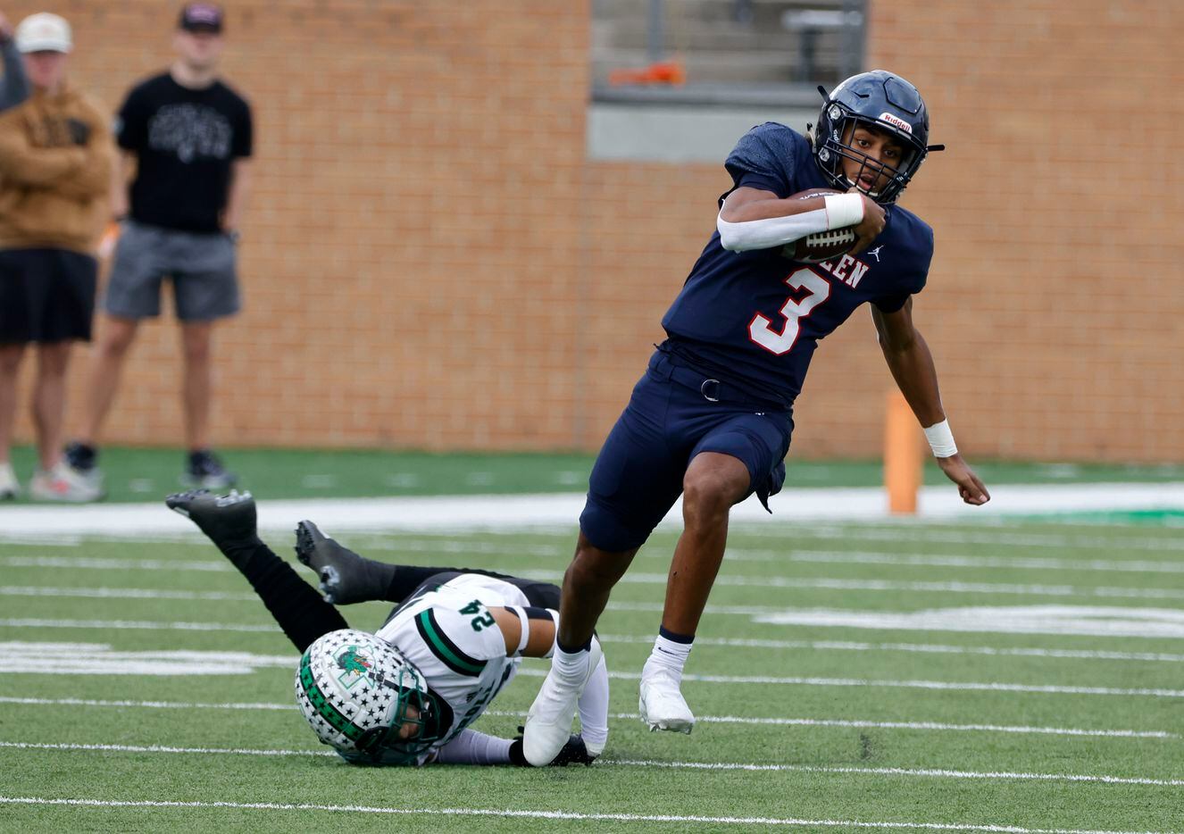 Allen quarterback Mike Hawkins (3) breaks out of a tackle by Southlake’s Max Reyes (24) to run for a long touchdown on the first play of the game during the first half of a Class 6A Division I Region I final high school football game in Denton, Texas on Saturday, Dec. 4, 2021. (Michael Ainsworth/Special Contributor)