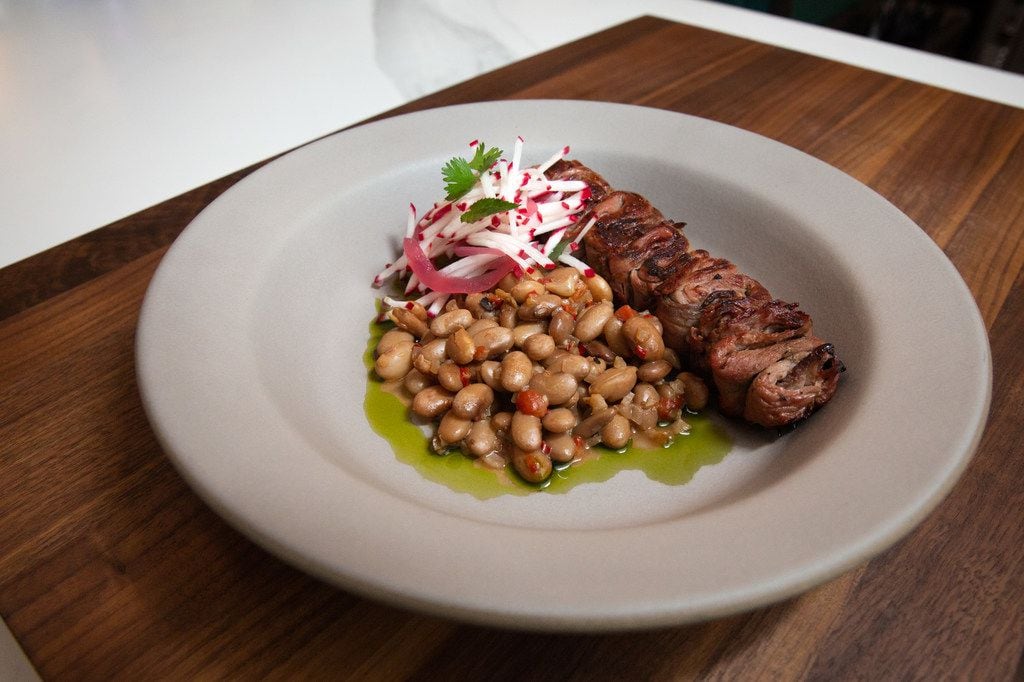 The skewered 2S Ranch grass-fed sirloin is brushed with fermented honey and served with...