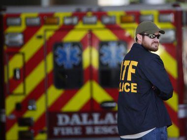 An ATF agents stands while authorities react outside of the Baylor University Medical Center...