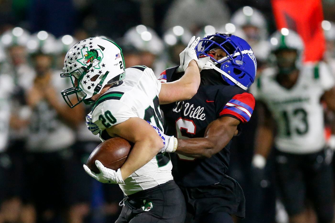 Duncanville’s Da’Myrion Coleman (6) tackles Southlake Carroll running back Zeke Zvonecek (20) during the second half of their Class 6A Division I state semifinal playoff game at McKinney ISD Stadium in McKinney, Texas, Saturday, Dec. 11, 2021. Duncanville defeated Southlake Carroll 35-9. (Elias Valverde II/The Dallas Morning News)