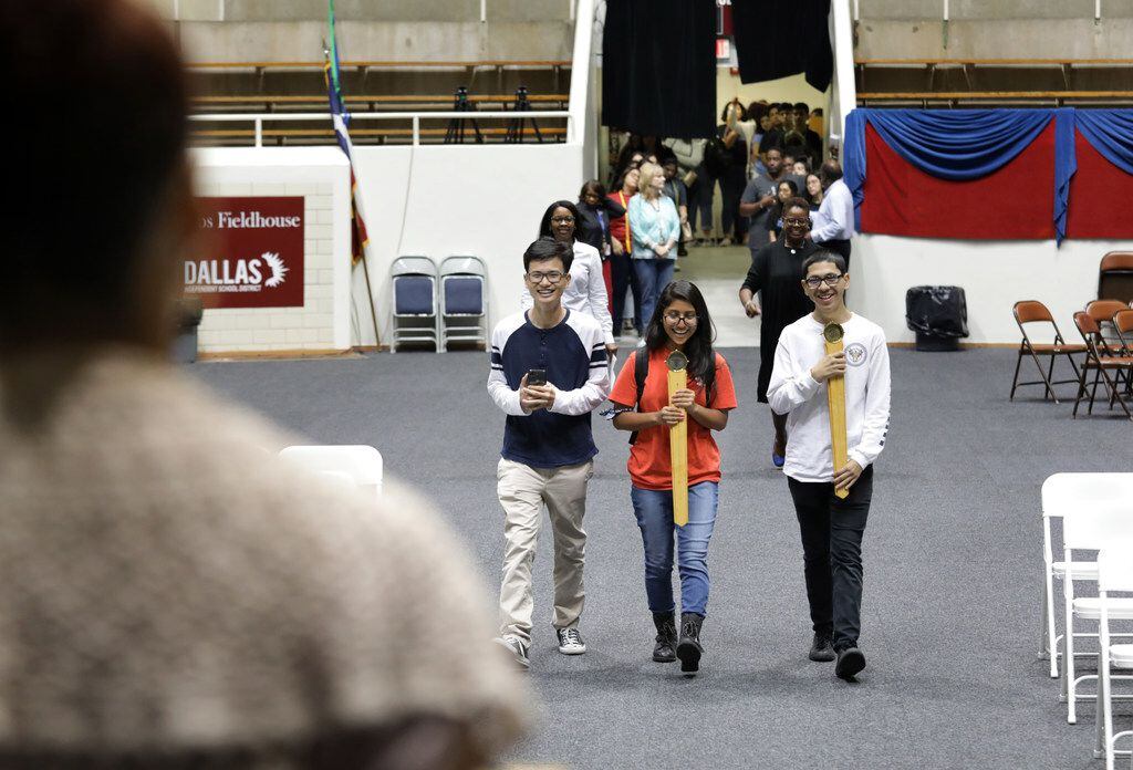 Co-valedictorians, 17-year-old Tri Truong, left, and 17-year-old Fatima Roque, center, rehearse their Townview School of Health Professions graduation entrance at the Alfred J. Loos Sports Complex in Addison, TX, on May 30, 2019. They are joined by Sorrells Education and Human Services Magnet valedictorian, 17-year-old Eddy Pineda, right, (Jason Janik/Special Contributor)