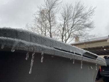 Icicles form on a trash bin in northeast Dallas on Tuesday, Jan. 31, 2023.