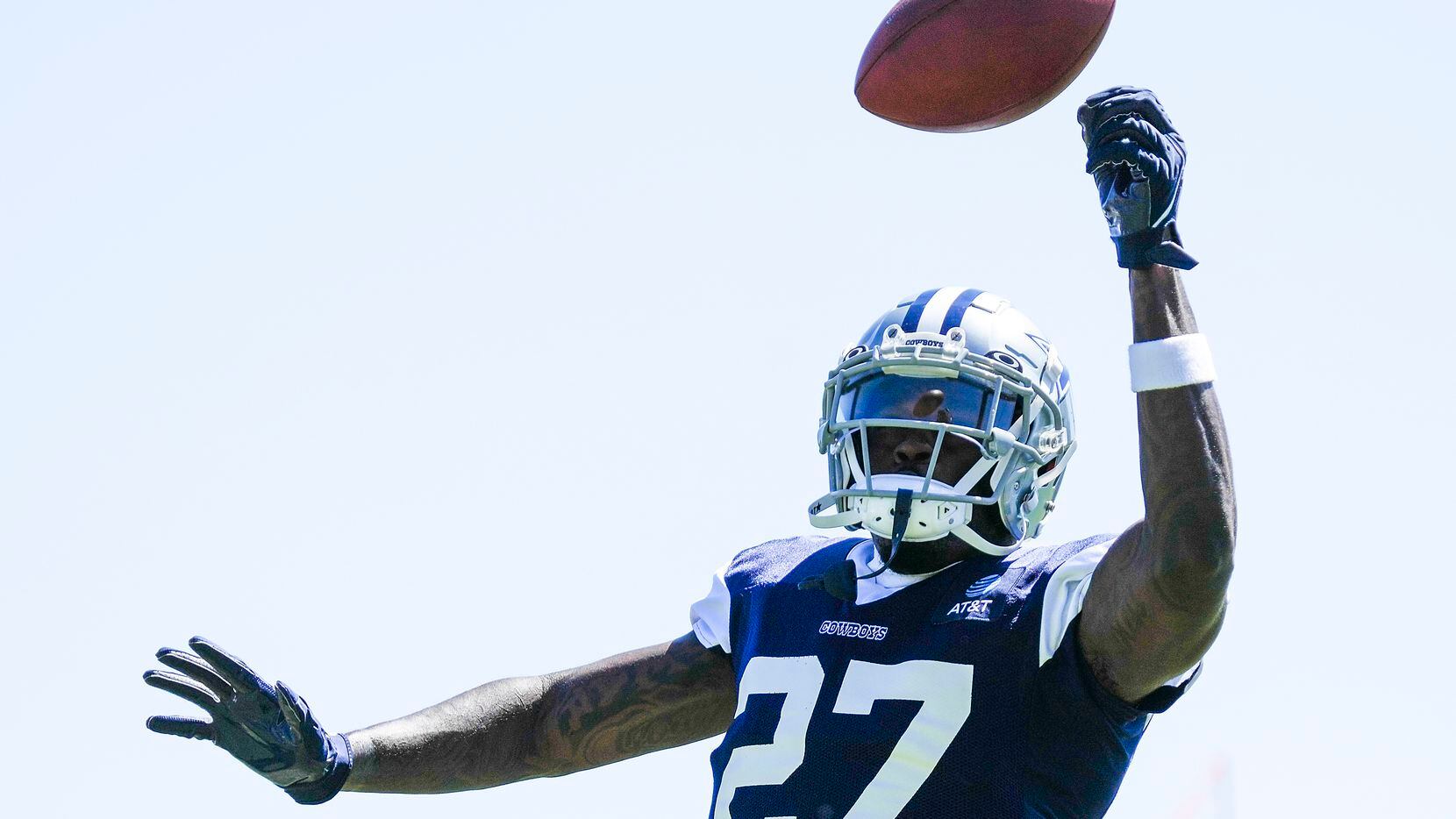 Dallas Cowboys safety Jayron Kearse (27) reaches for a ball during a training camp practice...