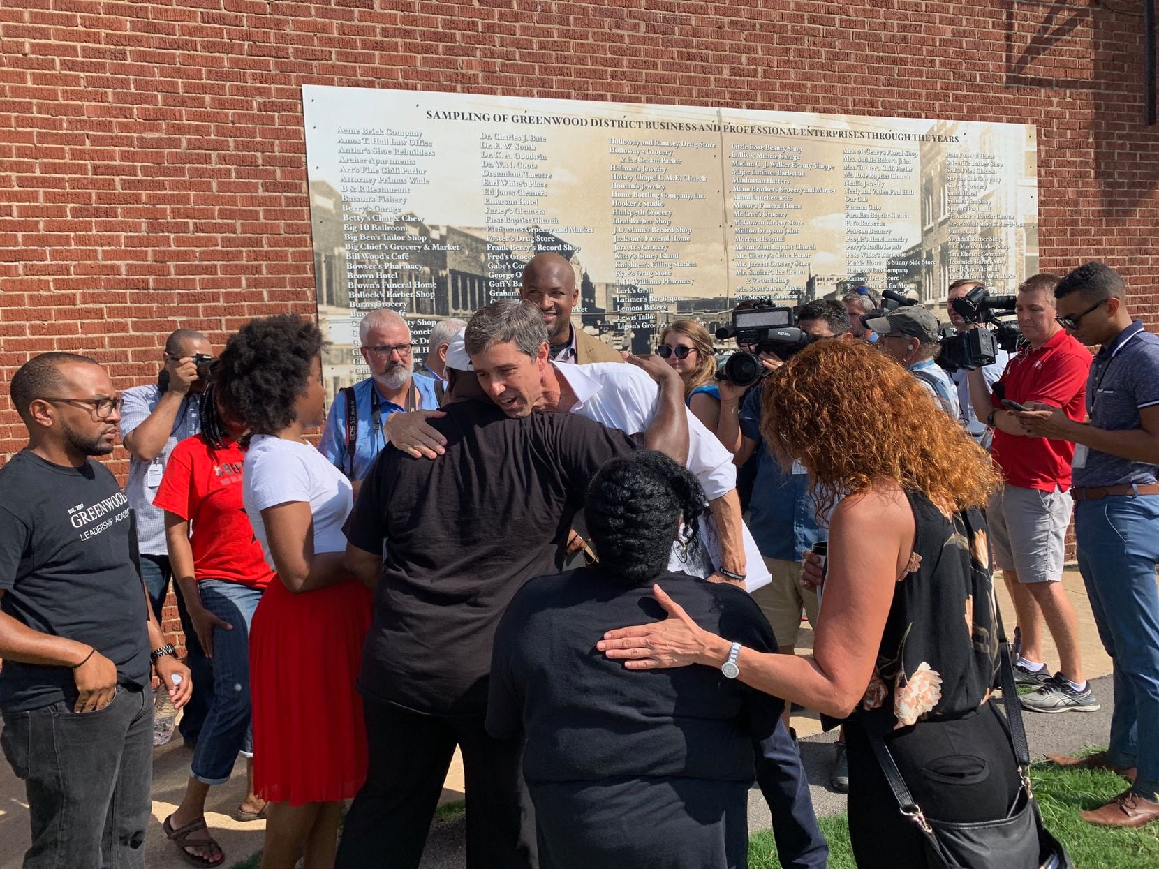 Democratic presidential hopeful Beto O'Rourke hugs a community activists during his tour of...