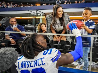 Dallas Cowboys defensive end Demarcus Lawrence (90) hands the Sunday Night Football Player...