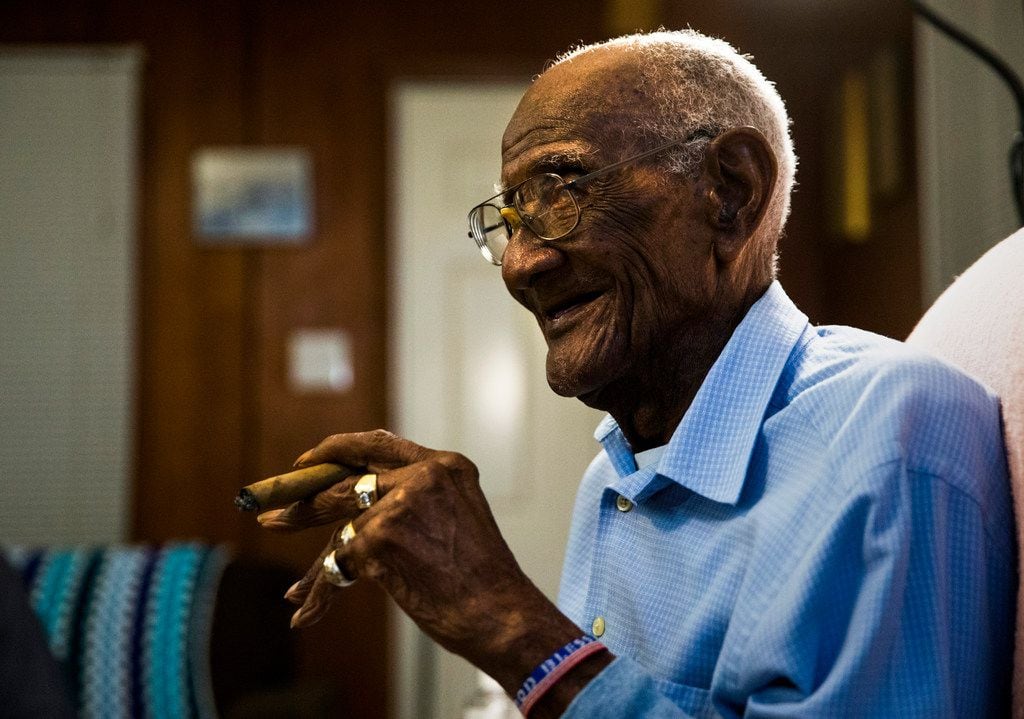 U.S. Army veteran Richard Overton, shown just before his 112th birthday, smokes one of his...