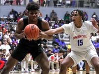 Duncanville forward Ashton Hardaway (15) tries to steal the ball from Garland center Zuby...
