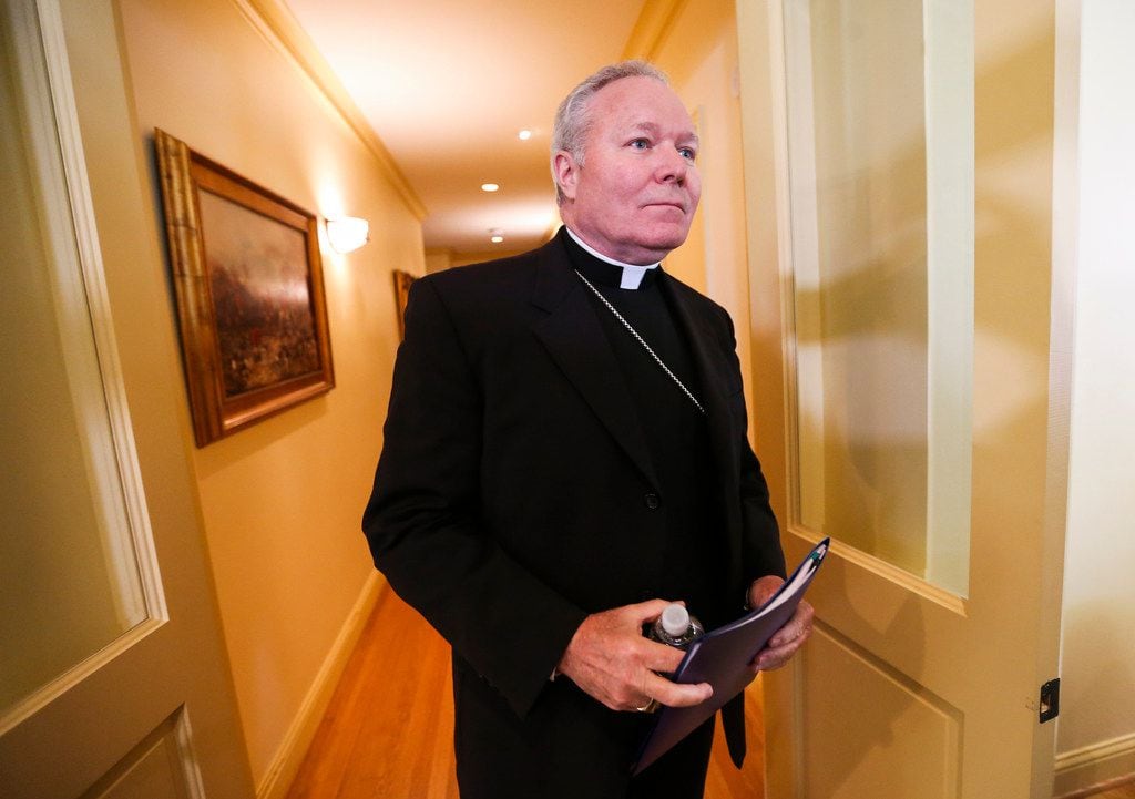 Bishop Edward Burns spoke to the media at Holy Trinity Catholic Church in Dallas after a...