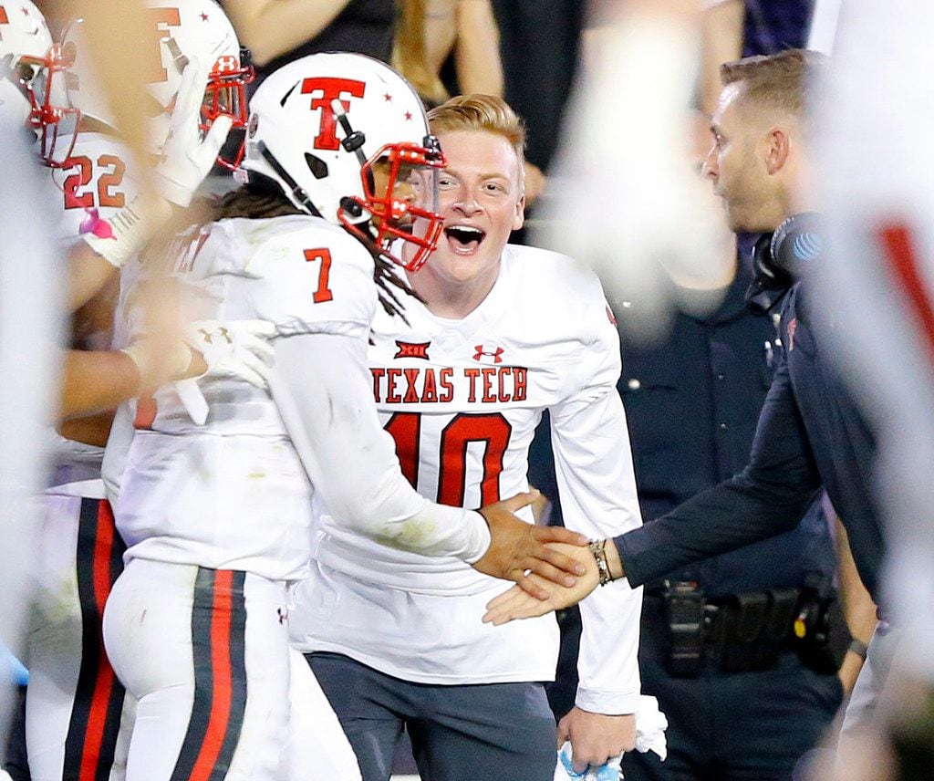 FILE - Texas Tech quarterback Jett Duffey (7) is congratulated by injured quarterback Alan Bowman (10) and head coach Kliff Kingsbury (right) after scoring the winning touchdown against TCU at Amon G. Carter Stadium in Fort Worth on Thursday, Oct. 11, 2018. (Tom Fox/The Dallas Morning News)