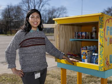 Marah Suarez pictured with community food pantry she founded, Maria's Bodeguita, in Dallas, on Thursday..