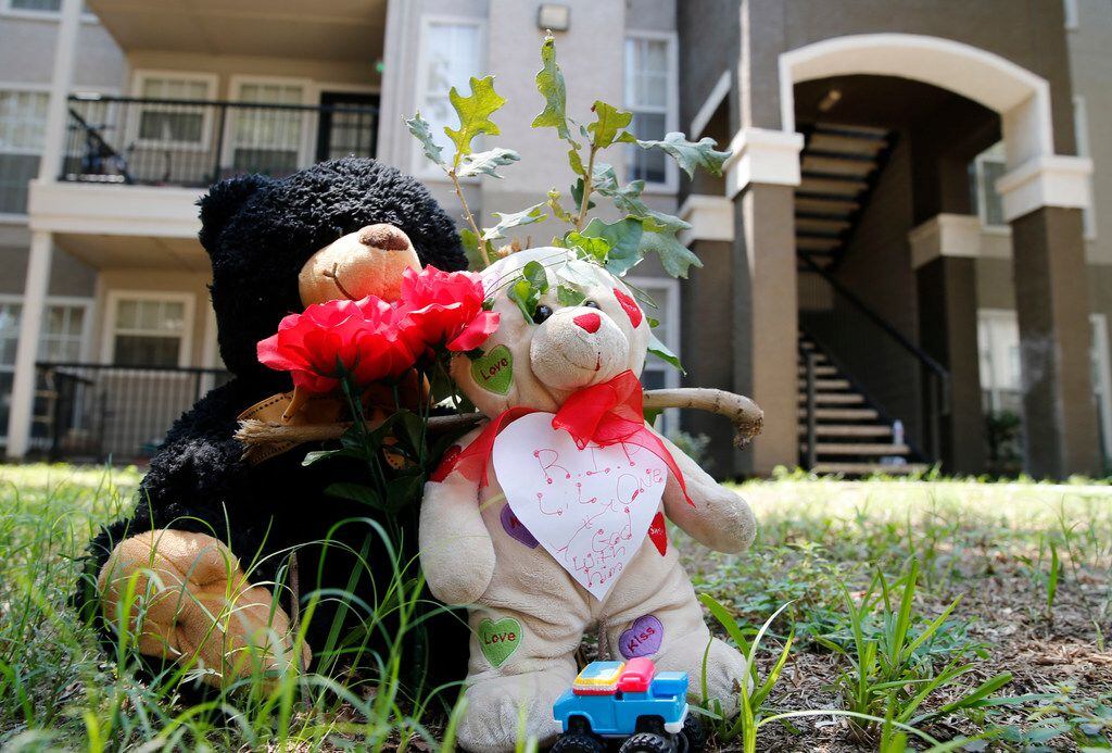 Bears rest near where a man that is accused of fatally stabbing and beating his 16-month-old...