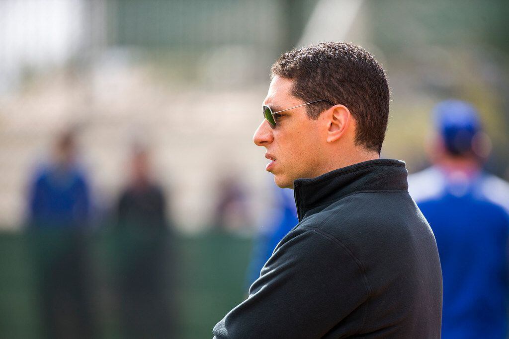 Texas Rangers general manager Jon Daniels watches his team during a spring training workout...