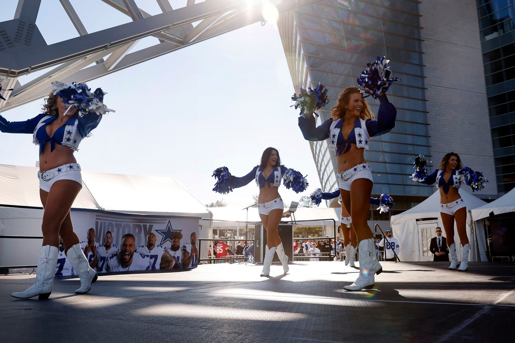 The Dallas Cowboys Cheerleaders perform for fans on the plaza before their NFL wild-card...
