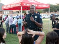 Richardson Police Department crime prevention officer Frank Bradford speaks to the crowd at...