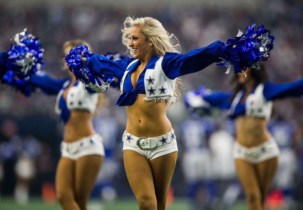 Dallas Cowboys cheerleaders perform during the season opener against the Ne...