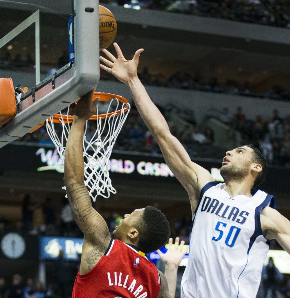 Dallas Mavericks center Salah Mejri (50) blocks a shot by Portland Trail Blazers guard...
