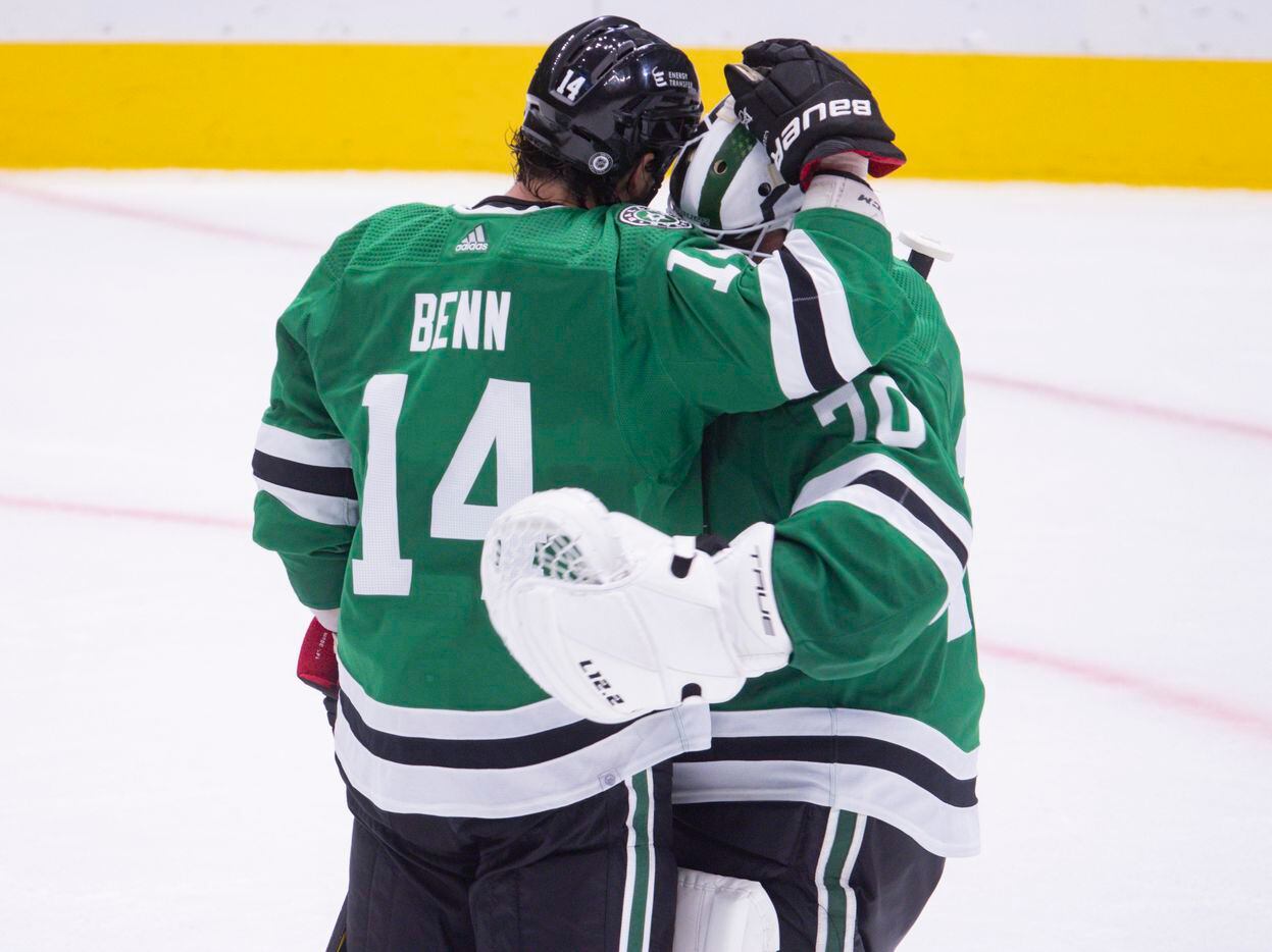 Dallas Stars left wing Jamie Benn (14) celebrates with Dallas Stars goaltender Braden Holtby (70) after their preseason game win against St. Louis Blues on Tuesday, Oct. 5, 2021, at American Airlines Center in Dallas. (Juan Figueroa/The Dallas Morning News)