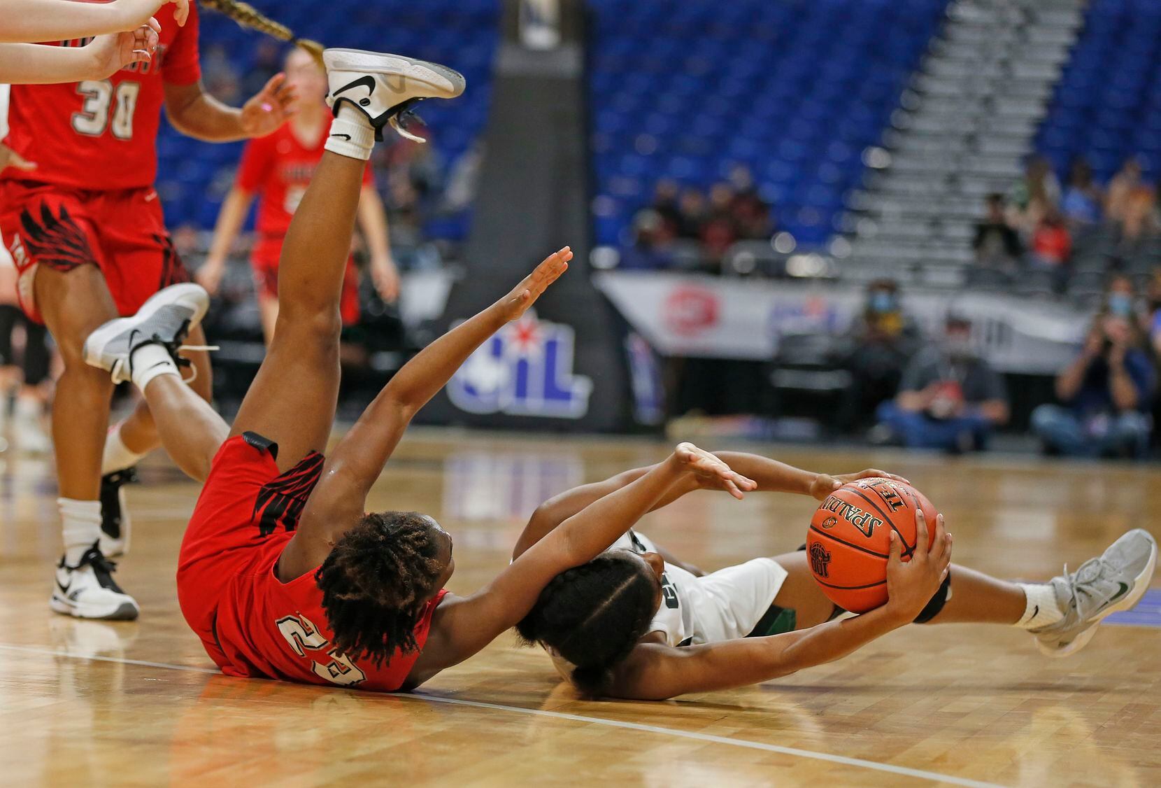 Frisco Liberty Journée Chambers #23 tries to steal the ball from Cedar Park Alisa Knight...