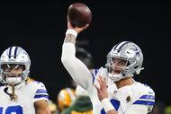 Dallas Cowboys quarterback Dak Prescott warms up before an NFL wild-card playoff football...