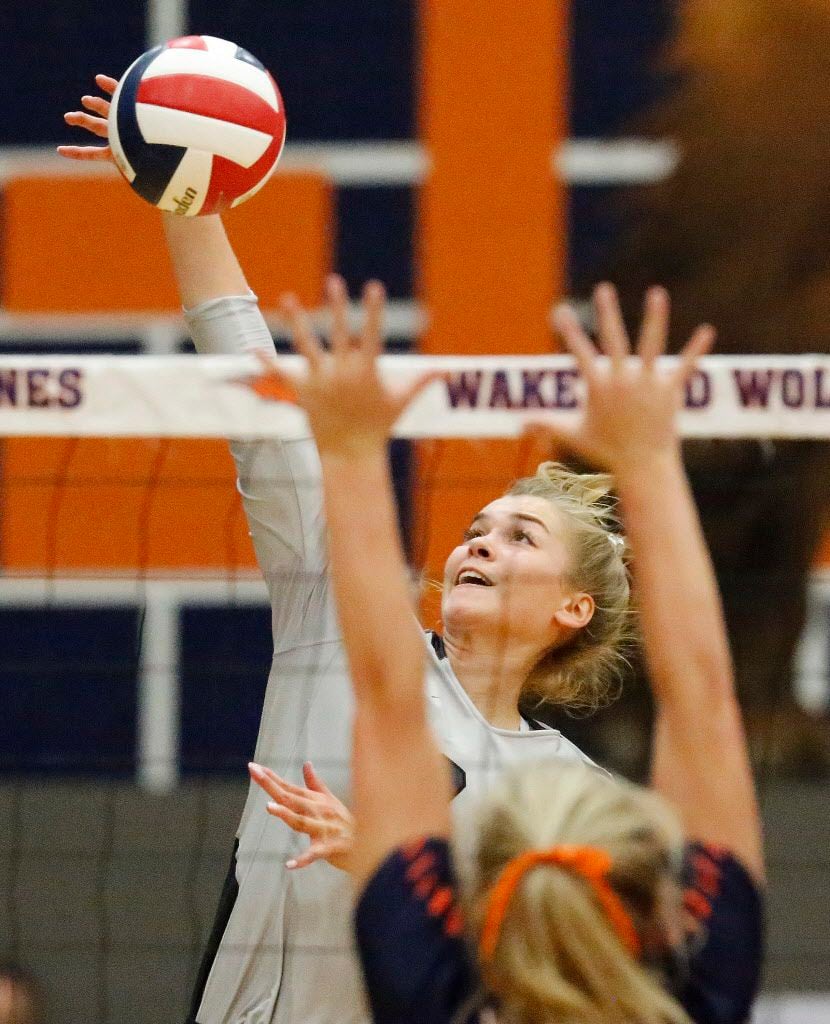 Liberty outside hitter Jenna Wenaas (2) gets a hit during game two as Wakeland High School...