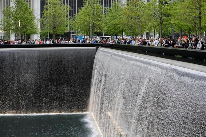 
This 2014 file photo shows patrons visiting the pools at The 9/11 Memorial near the World Trade Center in New York. President Barack Obama praised the new Sept. 11 museum as "a sacred place of healing and of hope" that captures both the story and the spirit of heroism that followed the attacks.
