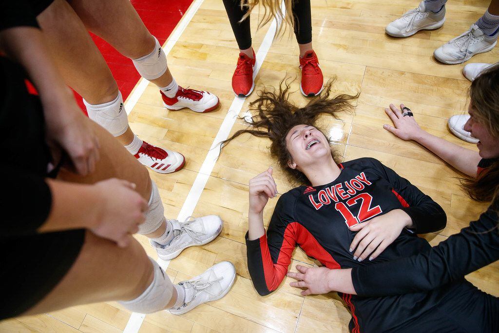LovejoyÃs Hannah Gonzalez (12) falls to the floor after celebrating a class 5A volleyball...