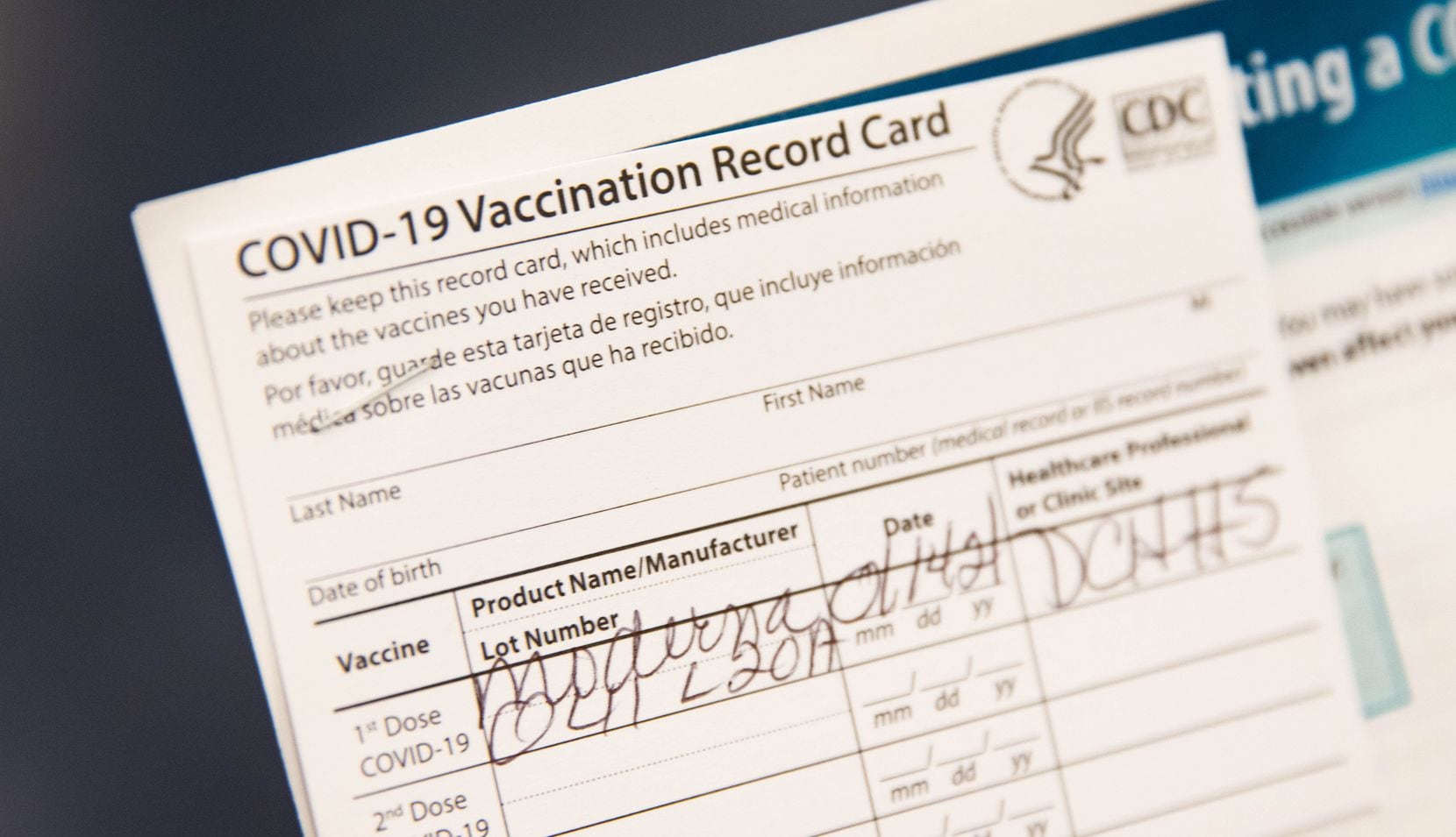 Gladys Rodgers, 77, holds her COVID-19 vaccination card at Fair Park in Dallas on Thursday,...