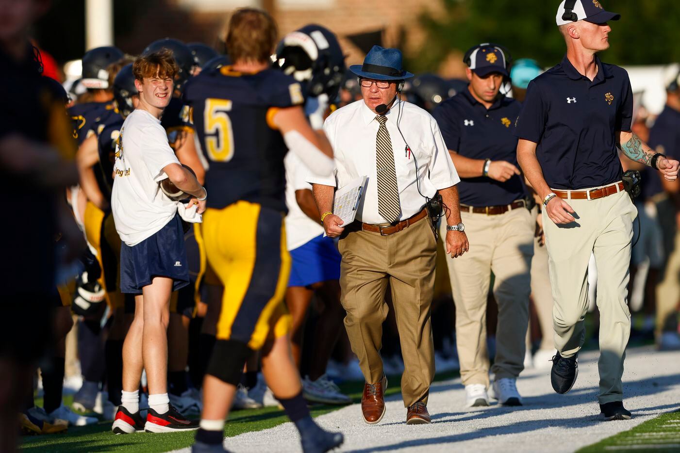 Highland Park coach Randy Allen walks the sideline the first quarter of the season-opening...