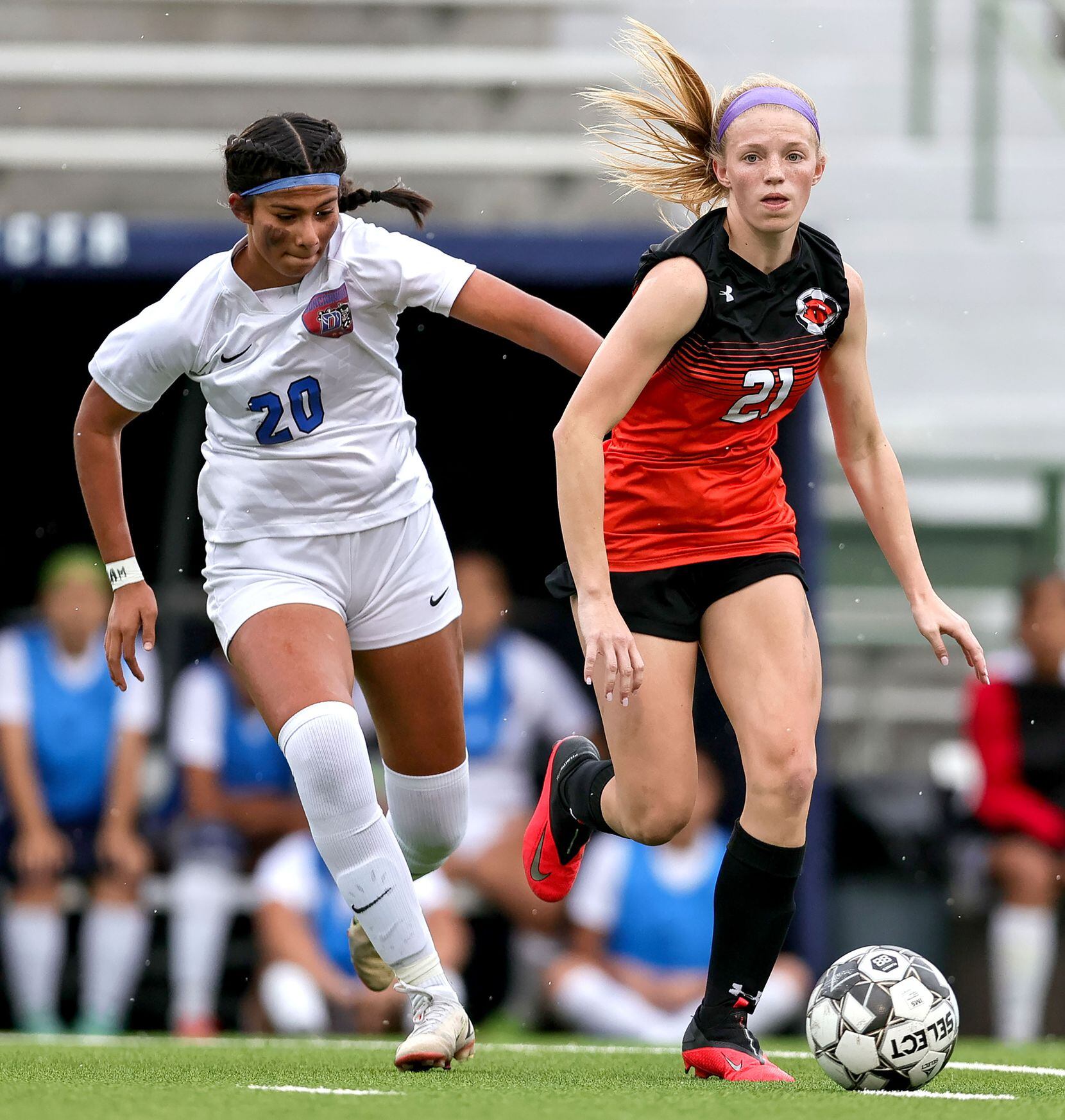 Rockwall Avery Shipman (21) tries to get past Duncanville Marily Garza (20) during the first...