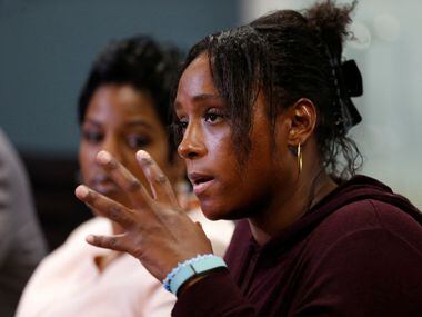 Latasha Nelson speaks during a press conference with alongside her two sons Trayvon, 14, and...