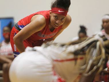 Duncanville forward Zaria Rufus (12) takes a breather as she awaits a teammate to put up a...