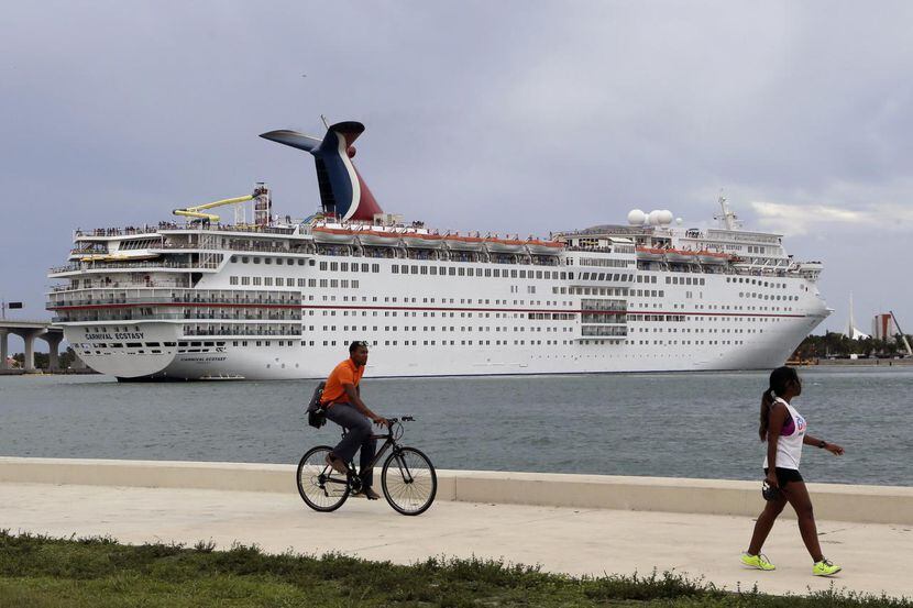 A Carnival Cruise ship sits docked in Cuba.