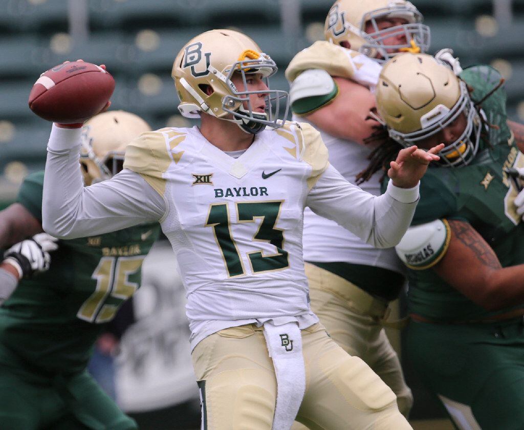 Baylor quarterback Zach Smith (13) passes during the first half of the NCAA college football...