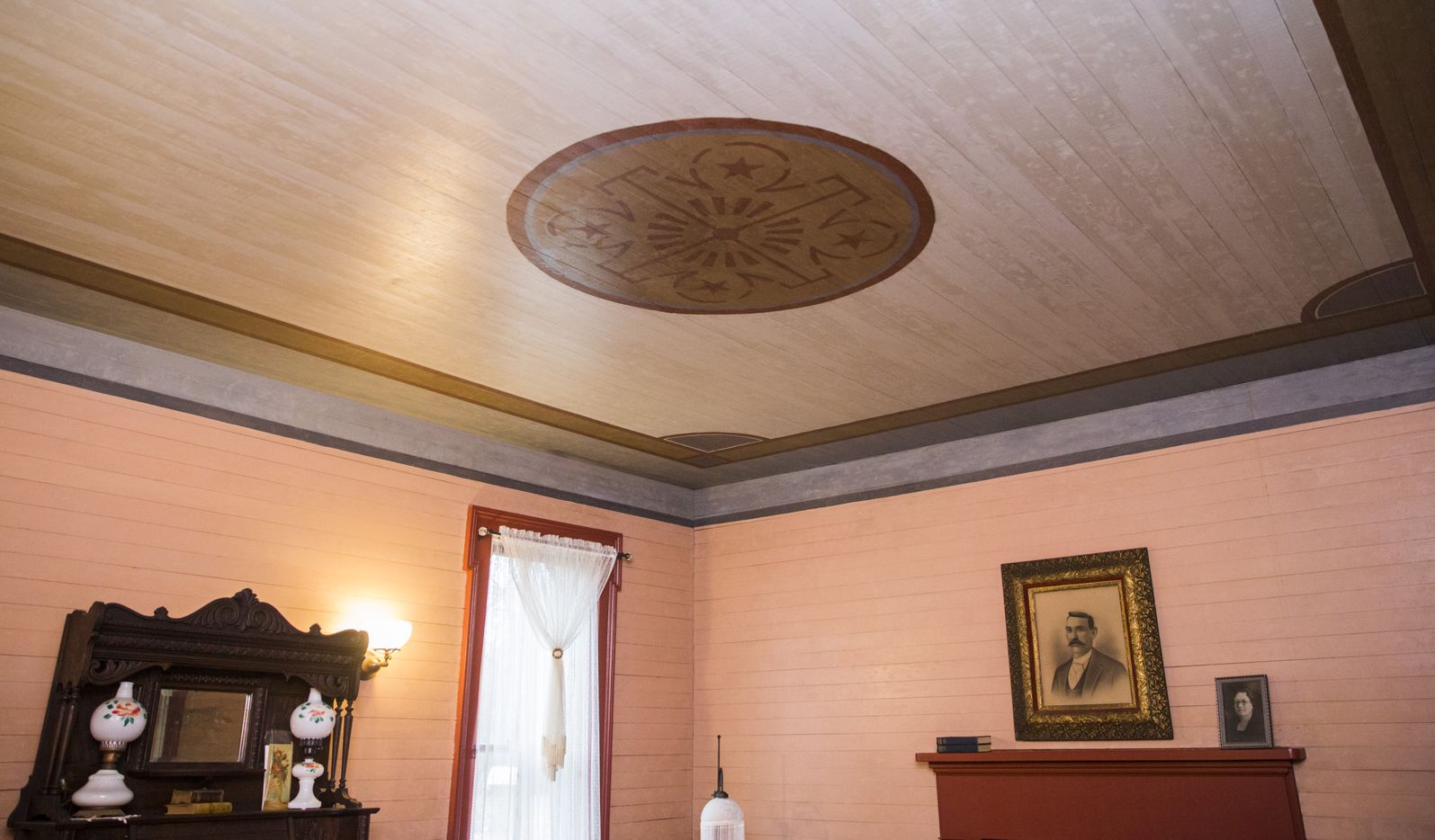 A painted ceiling in the music room inside the Lawrence House was among the discoveries that...