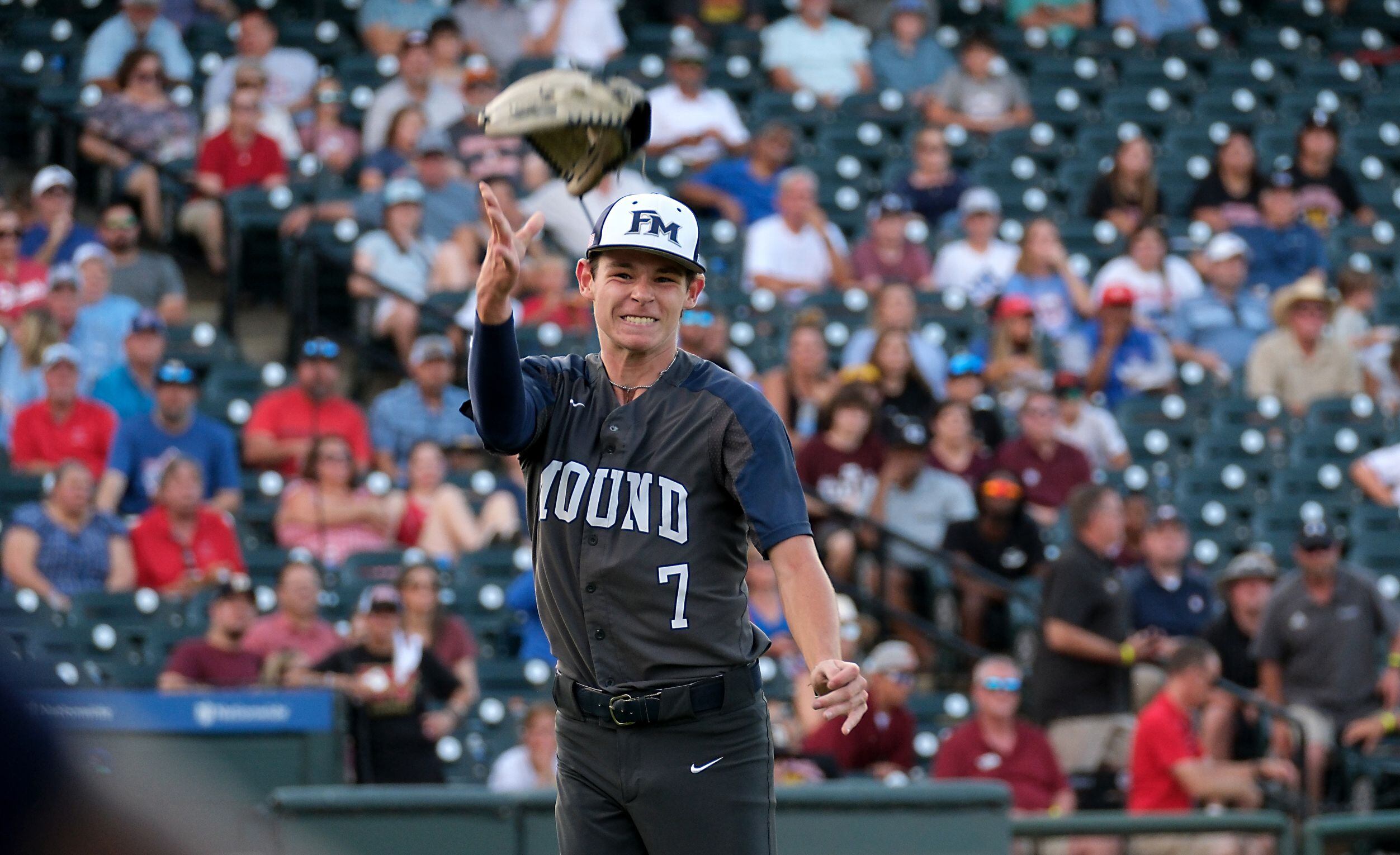 Flower Mound Zack James, (7), throws up his glove as he celebrates the team’s last out...