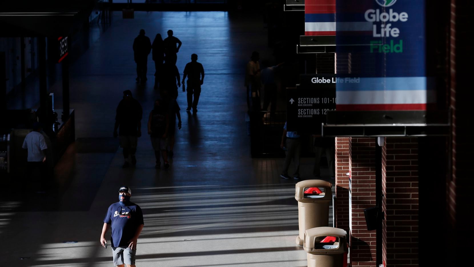 An Atlanta Braves fan walks through the concourse prior to the start of the National League Championship Series between the Atlanta Braves and the Los Angeles Dodgers  at Globe Life Field on Monday, October 12, 2020 in Arlington, Texas. This is the first time fans have been allowed into the stadium to watch a baseball game.