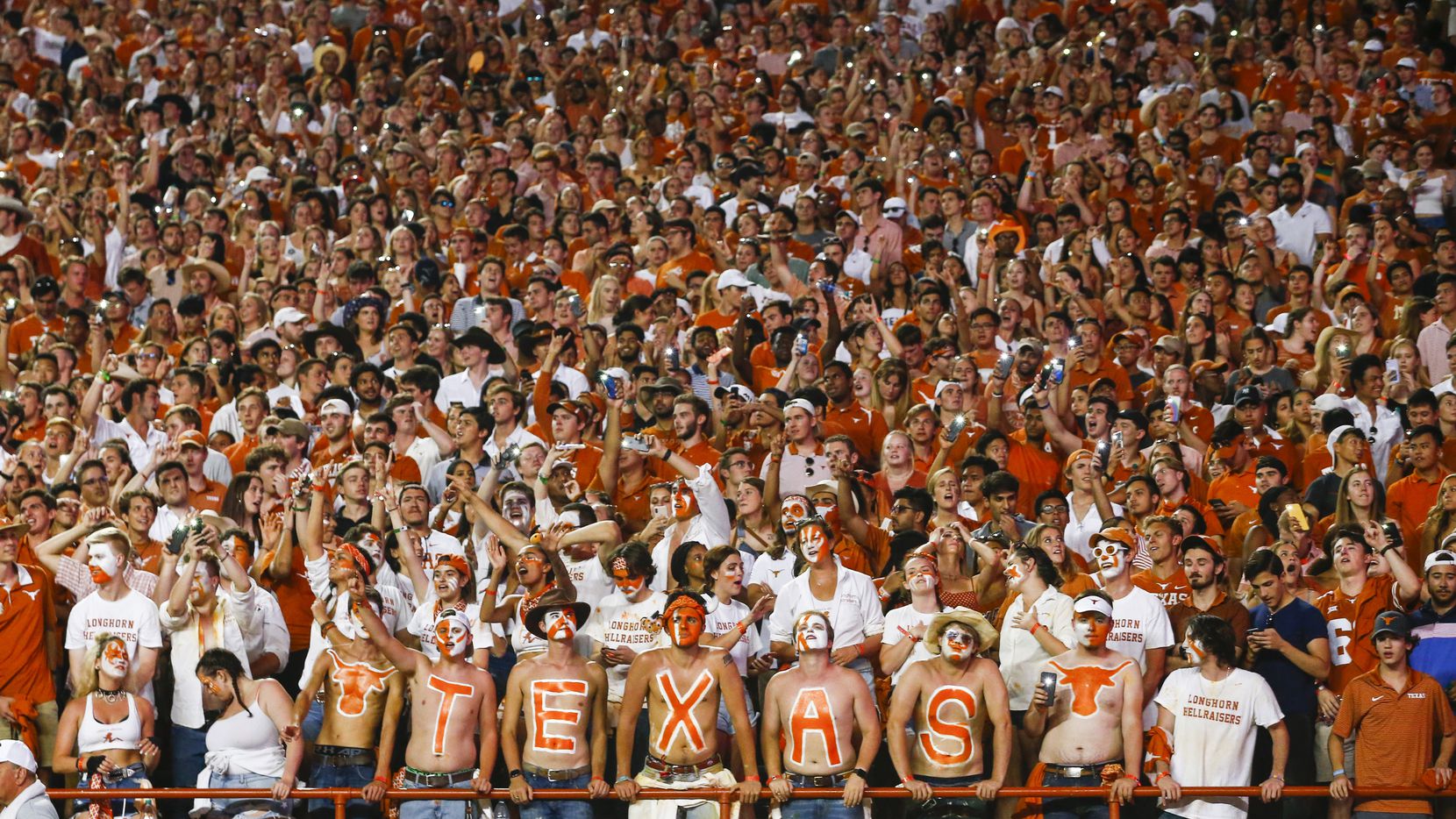 The Texas student section reacts during the fourth quarter of a college football game...
