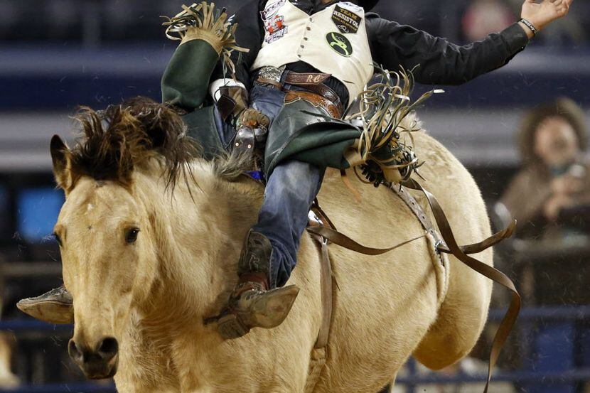 Richmond Champion competes during the RFD TV American rodeo at AT&T Stadium in Arlington. 