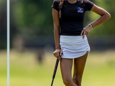 Hebron’s Symran Shah waits to putt on the 8th green during the 6A girls state golf...