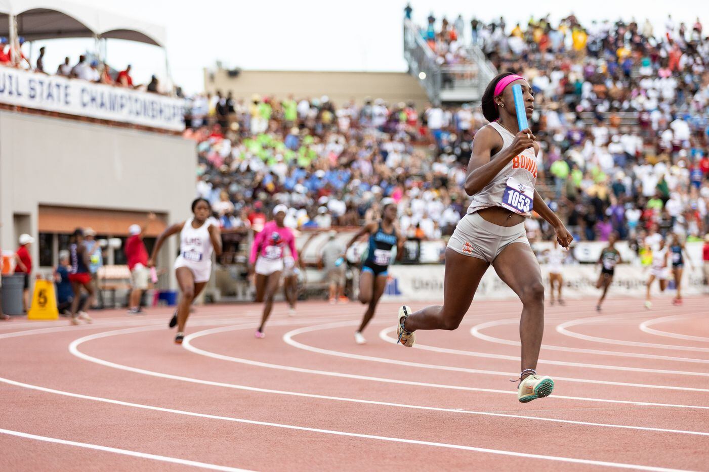 Tyler Brown of Arlington Bowie races in the girls’ 4x200-meter relay at the UIL Track &...