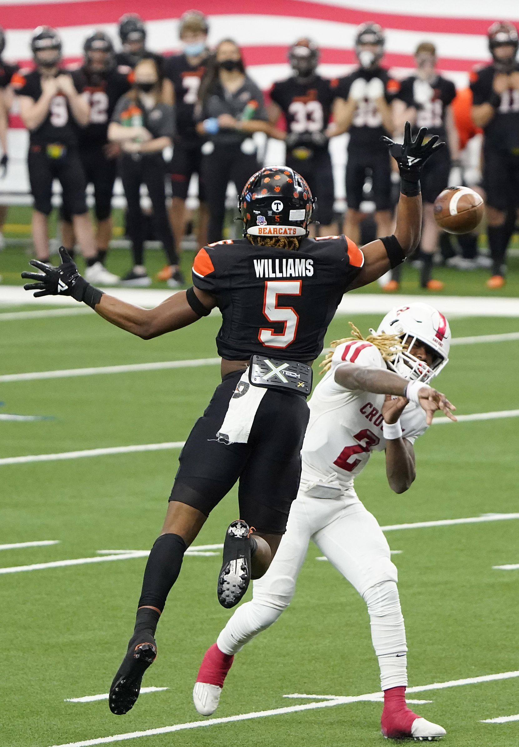 Crosby Deniquez Dunn (2) throws a touchdown pass under pressure from Aledo linebacker Ryan Williams (5) during the first half of the Class 5A Division II state football championship game at AT&T Stadium on Friday, Jan. 15, 2021, in Arlington. (Smiley N. Pool/The Dallas Morning News)