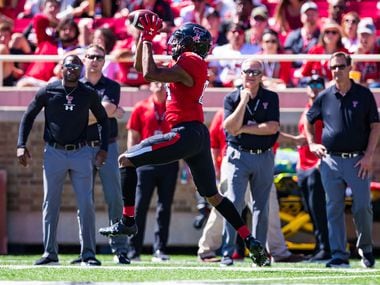 LUBBOCK, TEXAS - OCTOBER 05: Wide receiver Erik Ezukanma #84 of the Texas Tech Red Raiders catches a pass during the second half of the college football game against the Oklahoma State Cowboys on October 05, 2019 at Jones AT&T Stadium in Lubbock, Texas. (Photo by John E. Moore III/Getty Images)