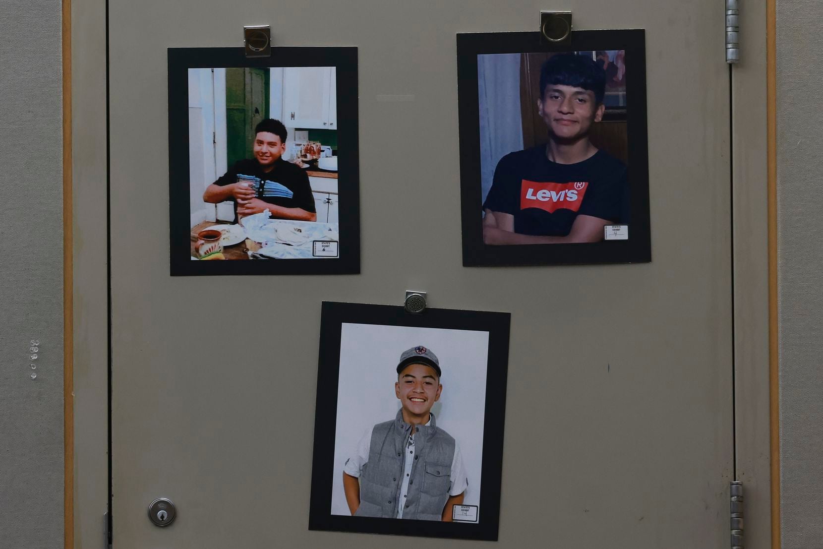 Photos of Ivan Noyola, Rafael Garcia and Xavier Gonzalez are on display in the courtroom.